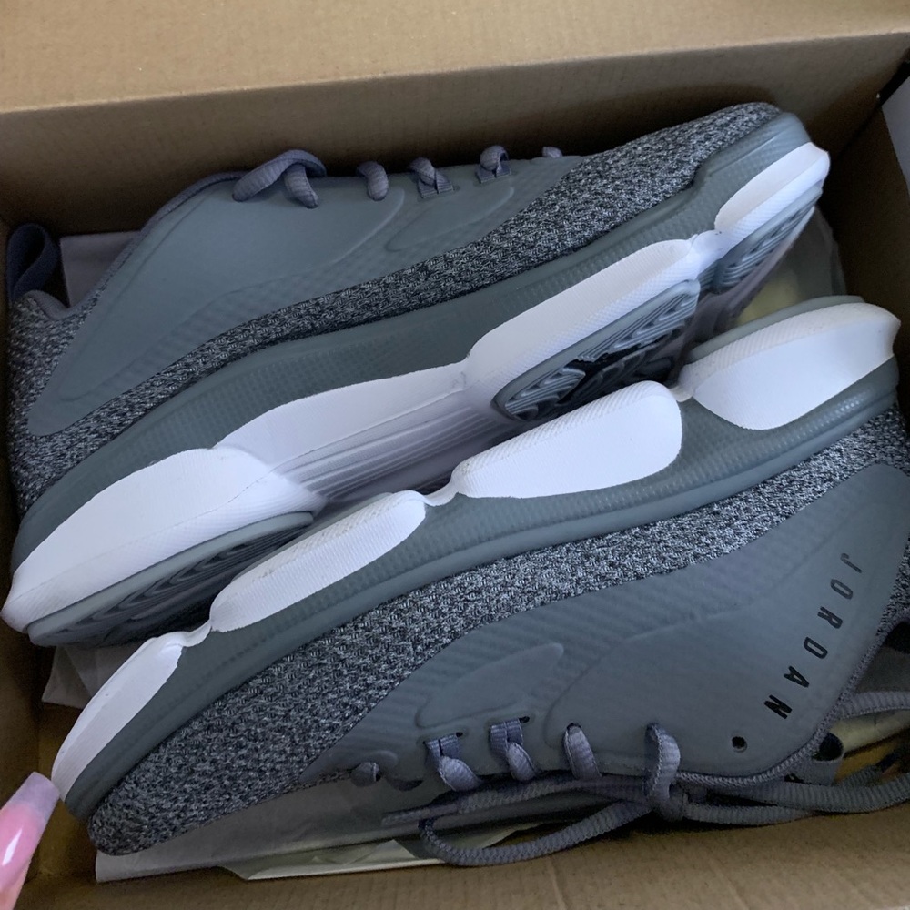 grey and white jordan’s